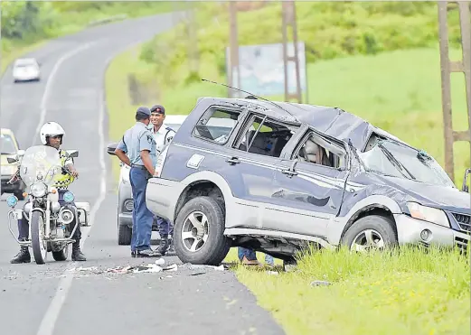  ?? Picture: RAMA ?? Police officers attend to an accident at Wainadoi outside Lami yesterday.