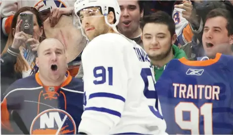  ?? BRUCE BENNETT/GETTY IMAGES ?? Toronto Maple Leafs centre John Tavares gets a rude welcome Thursday night at Nassau Coliseum in Uniondale, N.Y., as the former Islanders star returned to his one-time home for the first time since signing with Toronto in the off-season.