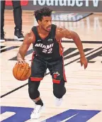  ?? KIM KLEMENT/ USA TODAY SPORTS ?? Jimmy Butler posted the third 40- point triple- double in NBA Finals history Sunday in the Heat’s victory.