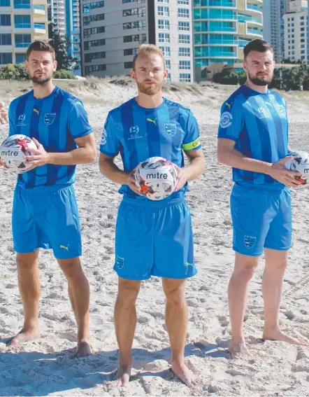  ?? Picture: GOLD COAST CITY FC ?? Sam Smith, captain Justyn McKay and Eoghan Murphy model Gold Coast City FC's new FFA Cup strips.