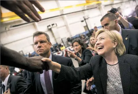  ?? Andrew Harnik/Associated Press ?? Democratic presidenti­al nominee Hillary Clinton greets supporters Thursday after her speech in Warren, Mich. Ms. Clinton appeared in the northern Detroit suburb 14 miles from where Donald Trump on Monday laid out his economic plan.