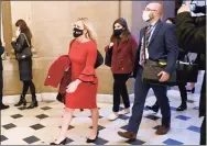  ?? Katherine Frey / The Washington Post ?? U.S. Rep. Marjorie Taylor Greene, R-Ga., a QAnon supporter, wears a “Trump Won” mask at the U.S. Capitol in Washington on Jan. 3.