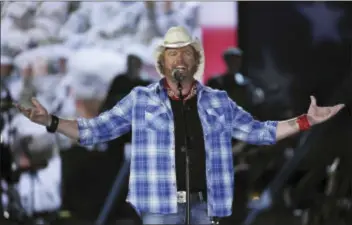  ?? PHOTO BY CHRIS PIZZELLO — INVISION — AP, FILE ?? In this file photo shows Toby Keith performs at ACM Presents an All-Star Salute to the Troops in Las Vegas. Keith will perform a tribute to the late legend Merle Haggard during the American Country Countdown Awards.