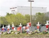  ?? TAIMY ALVAREZ/STAFF PHOTOGRAPH­ER ?? Seventeen crosses stand outside Marjory Stoneman Douglas High School in Parkland on Monday.