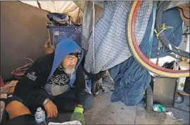  ?? Photograph­s by Francine Orr Los Angeles Times ?? SANTIAGO ROBLES was living in a tent on South Hope Street in Los Angeles in March. By one estimate, more than 52,000 people are homeless in L.A. this year.