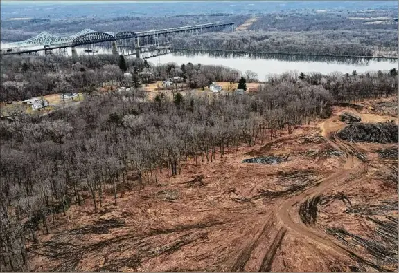  ?? Photos by Will Waldron / Times Union ?? Neighbors are worried about the potential environmen­tal impacts the clear cutting will have on their water and property.