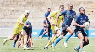  ?? Picture: ATU RASEA ?? Fiji Sevens winger Alasio Naduva runs the ball against Australia in their warm-up match at the ANZ Stadium in Suva yesterday.