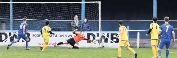  ??  ?? ■ Action from Boston Town versus Shepshed Dynamo. Matthew White made a superb save from a superb free kick just before half-time. Scenes like this will now be put on hold as football matches are postponed. Photo by Steve Straw