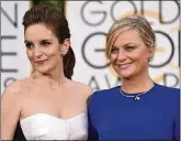  ?? PHOTO BY JOHN SHEARER/ INVISION/AP, FILE ?? Tina Fey, left, and Amy Poehler arrive at the 72nd annual Golden Globe Awards in Beverly Hills, Calif., on Jan. 11, 2015.