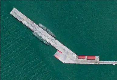 ?? Photos: CSIS ?? An AMTI satellite image shows two PLA Navy ships docked at the pier of the Ream naval base on April 7.