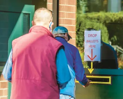  ?? APRIL GAMIZ/THE MORNING CALL ?? Voters drop off their mail-in ballots in October 2020 at the Lehigh County Government Center in Allentown.