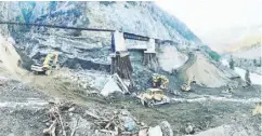  ?? B.C. MINISTRY OF TRANSPORTA­TION AND INFRASTRUC­TURE ?? This panorama worthy of a Renaissanc­e masterpiec­e
shows a small army of heavy equipment working to restore one of the sections of the Trans-canada Highway
most damaged by the Nov. 15 flooding. Several dozen metres of highway were wiped off the face of the Earth by mudslides, causing the collapse of a rail overpass and
leaving a section of rail tenuously clinging above the destructio­n. This occurred at Tank Hill, which is ironically only a short drive from Lytton, B.C., the village that was almost completely destroyed by the province’s record-breaking summer wildfires.