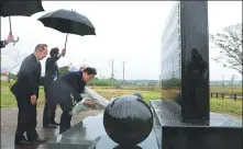  ?? KYODO NEWS VIA GETTY IMAGES ?? Japanese Prime Minister Fumio Kishida on Sunday offers flowers at a cenotaph in Fukushima, which was devastated by the March 2011 earthquake-tsunami disaster.