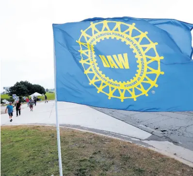  ?? AP PHOTOS ?? In this Monday, September 30, 2019 photo, United Auto Workers members picket during a strike at General Motors’ Orion assembly plant in Orion Township, Michigan.