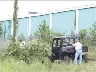  ?? Katie West • Times-Herald ?? Cleanup work is underway at the former Sanyo/Ruyi campus in the Forrest City Industrial Park. The property was recently sold to Olymbec USA LLC, of Memphis.