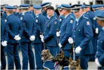  ??  ?? Police salute their colleague.