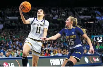  ?? AP PHOTO/MICHAEL CATERINA ?? Notre Dame guard Sonia Citron drives to the basket past Kent State forward Bridget Dunn during the second half of an NCAA tournament first-round game Saturday in South Bend, Ind.