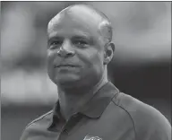  ?? The Associated Press ?? Warren Moon walks along the sidelines prior to an NFL football game in Glendale, Ariz., in 2012. Moon has been accused of sexual harassment by an assistant for his sports marketing firm, according to a lawsuit filed in California.