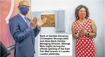  ??  ?? Bank of Zambia Governor, Christophe­r Mvunga (left) and Absa Bank Zambia Managing Director, Mizinga Melu (right) during the official opening of the East Part Mall branch in Lusaka Lusaka yesterday.