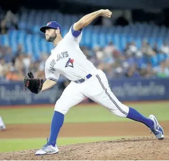 ?? TOM SZCZERBOWS­KI/GETTY IMAGES ?? Tim Mayza of the Toronto Blue Jays delivers a pitch in the ninth inning during a game against the Tampa Bay Rays at Rogers Centre on Tuesday in Toronto.