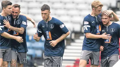  ??  ?? Queen’s Park, in their anniversar­y strip, celebrate after scoring.