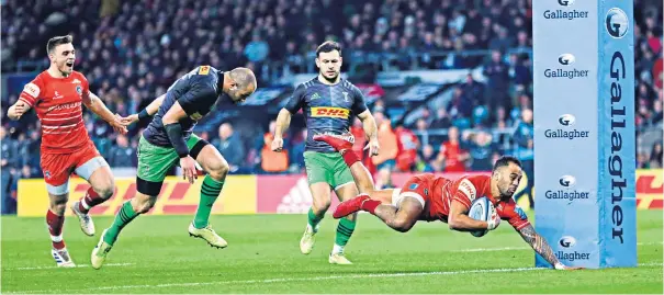  ??  ?? Opener: Paul Lasike of Harlequins dives over to score his side’s first try during the Gallagher Premiershi­p Rugby ‘Big Game’ against Leicester at Twickenham, but the hosts were denied an important victory by their guests