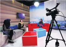  ??  ?? Zan TV presenters record a morning programme. The station uses low-cost digital technology and a basic studio in the Afghan capital.