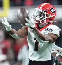  ?? AP PHOTOS ?? Christian Watson (clockwise from top left), Skyy Moore, George Pickens and John Metchie III are options for the Bears.