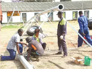  ?? ?? Debont workers assemble a centre pivot irrigation system yesterday in preparatio­n for the opening of the Zimbabwe Agricultur­al Show on Monday