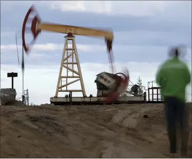  ?? THE ASSOCIATED PRESS ?? An oil rig near the town of Usinsk, 1500kilome­ters (930miles) northeast of Moscow is shown. The European Commission has launched proceeding­s that could ultimately lead to the partial suspension of support payments to Hungary for breaching the 27-nation bloc’s rule-of-law standards. The EU’s executive arm said Wednesday, April 27, 2022that it has given Hungary formal notificati­on and the country has two months to provide explanatio­ns and propose remedies.