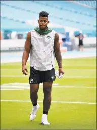  ?? Mark Brown / Getty Images ?? Jets TE Chris Herndon warms up prior to last week’s game at Miami.