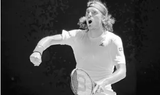  ?? AP PHOTOS ?? Stefanos Tsitsipas of Greece reacts after winning a point against Karen Khachanov of Russia during their semifinal at the Australian Open tennis championsh­ip in Melbourne, Australia, yesterday.