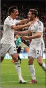  ??  ?? ON TARGET: Scorer Cork (left) celebrates his goal with Grimes