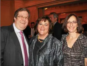  ??  ?? Sharon Tobin Kestenbaum, of Bryn Mawr, center, is glad to see her local friends, David and Debra Jokleson, of Lower Merion.