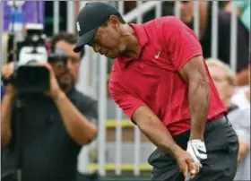  ?? DAVID DERMER — THE ASSOCIATED PRESS ?? Tiger Woods follows his shot from the rough on the seventh hole during the final round of the Memorial golf tournament Sunday in Dublin, Ohio.