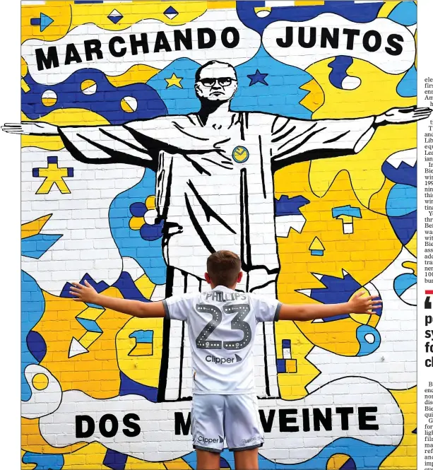  ??  ?? MARCELO’S MURAL: Leeds fan Kailen Hatfield, 12, mimics the painting of the club’s Argentine manager as Christ the Redeemer in the Wortley district of the city