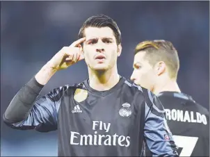  ?? FILIPPO MONTEFORTE/AFP ?? Real Madrid forward Alvaro Morata celebrates after scoring against Napoli in the Champions League in Naples on March 7. Real Madrid won 3-1.