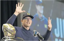  ?? AP FILE ?? Michigan coach Jim Harbaugh hasn’t released an updated depth chart since last season and won’t reveal who his starting quarterbac­k will be for the season opener.