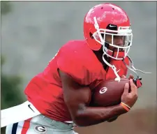  ?? JOSHUA L. JONES / The Associated Press ?? Georgia running back D’Andre Swift runs a drill at a recent Bulldogs’ practice. Swift goes into his sophomore season in Athens as the favorite to win the starting job at running back.