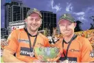  ??  ?? >
Ian with Tim Bresnan after winning the Big Bash with Perth Scorchers