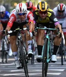  ?? Marco Bertorello/ Getty Images ?? Caleb Ewan, left, edges Dylan Groenewege­n in a photo finish Wednesday to win Stage 11 of the Tour de France in Toulouse, France.