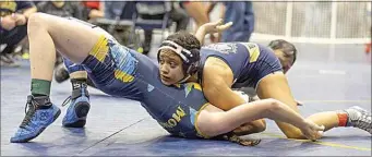  ?? ROD THORNBURG / FOR THE CALIFORNIA­N ?? Golden Valley’s Ce Ariah Sands takes control of her match against Portervill­e-Monache’s Kaylynn Brassfield in their 133-pound semifinal. Sands won by fall in 47 seconds.