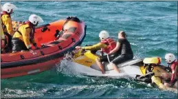  ??  ?? RESCuE: The stricken family at Newquay are transferre­d to a lifeboat