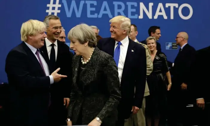  ??  ?? Boris Johnson, then foreign secretary (left), jokes with Donald Trump as Theresa May walks past during a Nato working dinner in May 2017. Photograph: Matt Dunham/AP