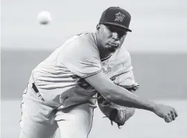  ?? TODD KIRKLAND Getty Images ?? Marlins rookie starter Sixto Sanchez was roughed up, giving up four runs in three innings with a career-high four walks in a critical 9-4 loss to the Braves on Wednesday night.