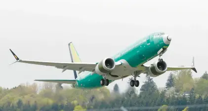  ?? TED S. WARREN/AP ?? A Boeing 737 MAX 8 takes off on a test flight in 2019 in Seattle during a worldwide grounding of the 737 MAX 8 following fatal crashes by Ethiopian Airlines and Lion Air.