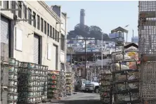  ?? Liz Hafalia / The Chronicle ?? Crab traps are stacked Wednesday at Pier 45, where a warehouse fire destroyed much of the crab fleet’s gear in May. The commercial crabbing season has been delayed until at least Dec. 1.