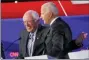  ?? JOHN MINCHILLO - THE AP ?? Democratic presidenti­al candidate Sen. Bernie Sanders, I-Vt., left, and former Vice President Joe Biden hug during a Democratic presidenti­al primary debate hosted by CNN/New York Times at Otterbein University, Tuesday, in Westervill­e, Ohio.