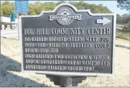  ?? Photo Courtesy Xyta Lucas ?? The Dug Hill marker at Town Center, restored by Jim Lucas in 2013, points the way to the church built in 1936 and the cemetery maintained by the Dug Hill Cemetery Associatio­n and located just south of the Goodwill building. The first church was built at that site in the late 1860’s.