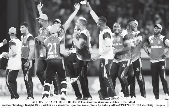  ?? ?? ALL OVER BAR THE SHOUTING! The Amazon Warriors celebrate the fall of another Trinbago Knight Rider wicket as a semi-final spot beckons (Photo by Ashley Allen-CPLT20/CPLT20 via Getty Images).